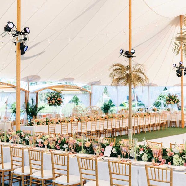 Elegant event tent, long tables and Chiavari chair rentals for wedding reception | Hunter Ryan Photo | Niche Event Rentals