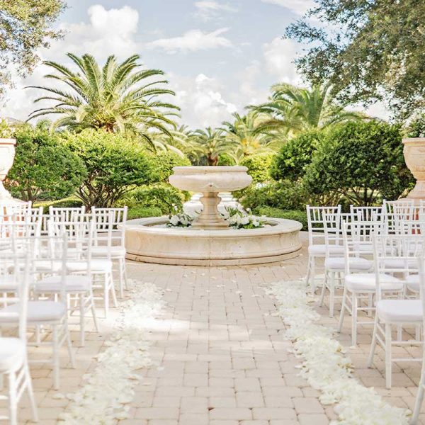 Garden wedding ceremony with white Chiavari chairs | Allie Ryann Photography | Niche Event Rentals