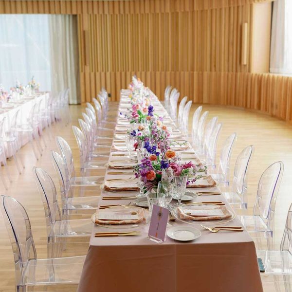 Long table setting with ghost chair rentals from Niche Event Rentals | Madeline Paige Photography
