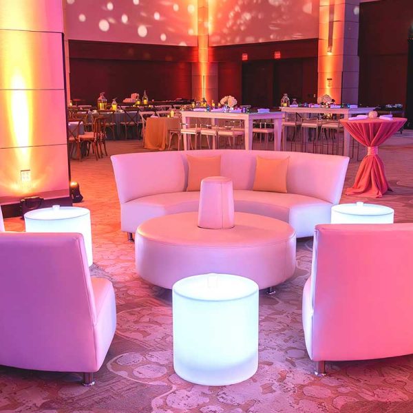 Lounge collection curved sofas with small glow cylinder rentals from Niche Event Rentals | Tyson Bonar Photo