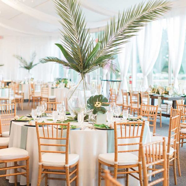Tropical reception with natural Chiavari chair rentals from Niche Event Rentals | The Hendricks Photo
